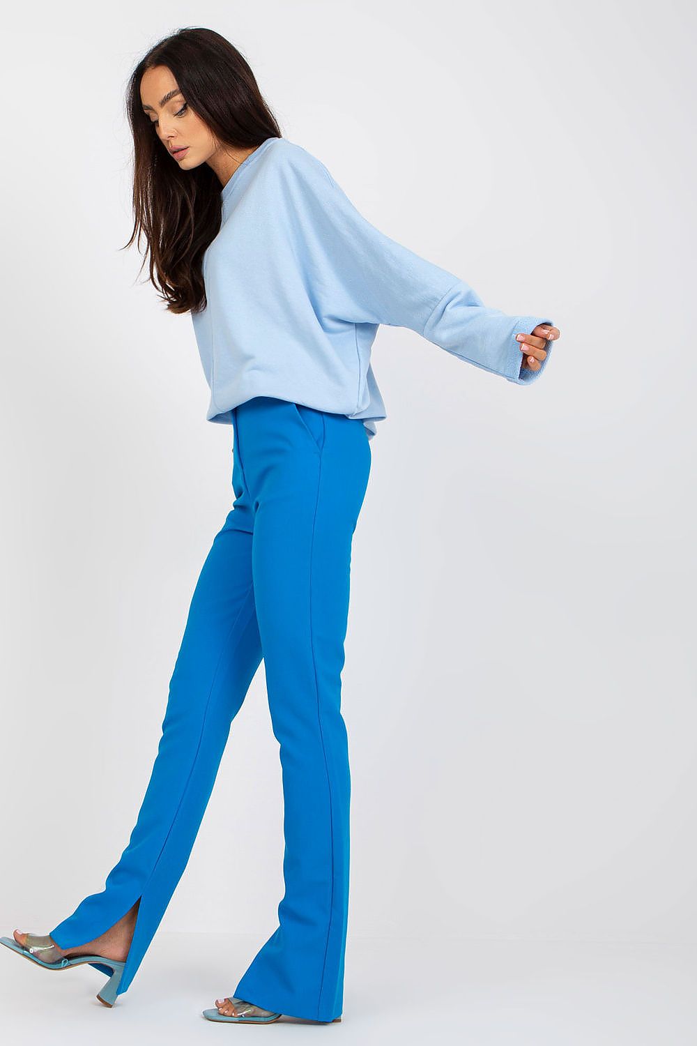 Trendy layering with Women's Loose Fit Cotton Spandex Sweatshirt with Round Neckline by Rue Paris in contemplative light blue, stylishly matched with striking blue flared trousers.