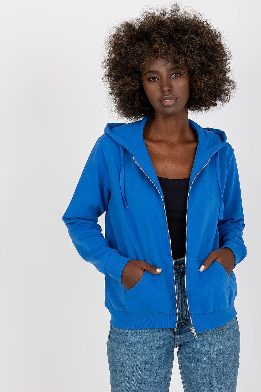 Chic model wearing Women’s Luxury Hooded Zippered Sweatshirt With Front Pockets - BFG, Cotton-Blend Fabric in vibrant blue, perfect for a fashionable look.