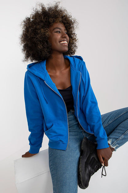 Joyful model smiling while styled in Women’s Luxury Hooded Zippered Sweatshirt With Front Pockets - BFG, Cotton-Blend Fabric, showcasing a blend of comfort and luxury.