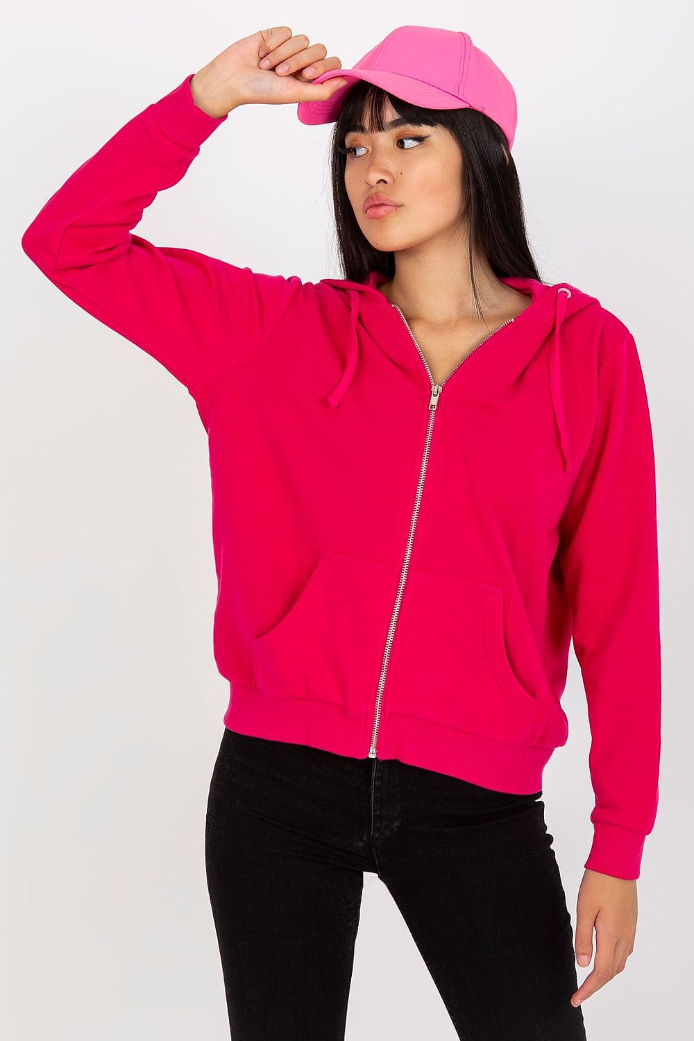 Women’s Luxury Hooded Zippered Sweatshirt with Front Pockets - BFG, Cotton-Blend Fabric. Model in a vivid pink sweatshirt paired with a matching cap, exemplifying a luxurious yet casual look.
