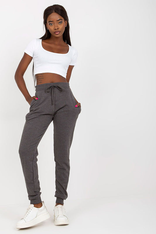 BFG High-Waisted Tracksuit Trousers with Elastic Waistband and Side Slip Pockets, model showcasing stylish grey sweatpants paired with a fitted white top, elegant and comfortable design.