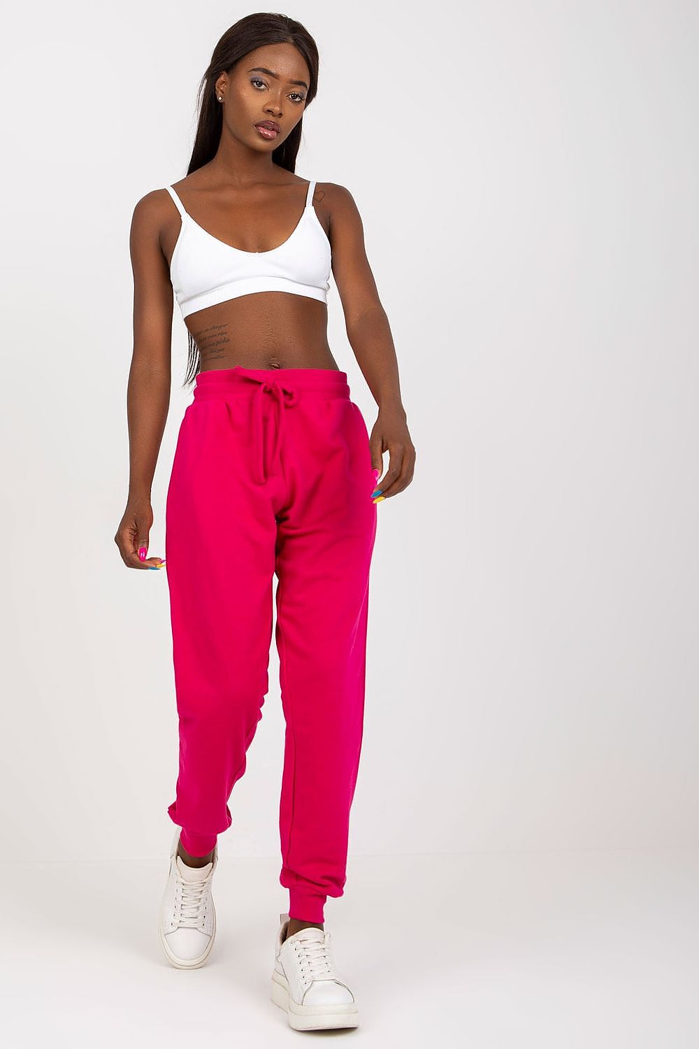 Sophisticated look featuring BFG High-Waisted Tracksuit Trousers with Elastic Waistband and Side Slip Pockets in vibrant pink, paired with a white bralette for a trendy casual outfit.