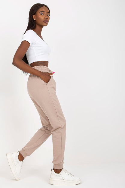 Side view of a model wearing BFG High-Waisted Sweatpants with Elastic Waistband and Side Pockets, highlighting the chic design and effortless comfort of these premium cotton blend trousers.