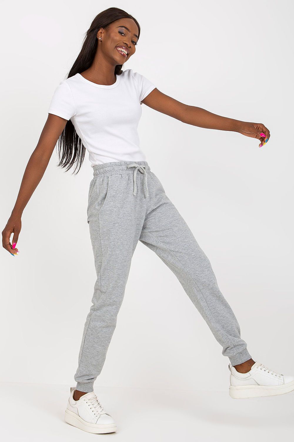 BFG High-Waisted Sweatpants with Elastic Waistband and Side Pockets, elegantly displayed in grey, paired with a chic white t-shirt, exuding casual luxury.