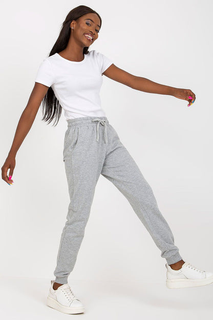 BFG High-Waisted Sweatpants with Elastic Waistband and Side Pockets, elegantly displayed in grey, paired with a chic white t-shirt, exuding casual luxury.
