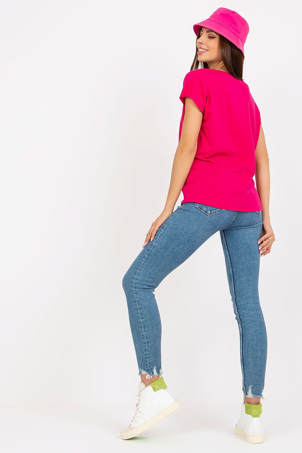 Fashionable back view of the Luxurious Heart Neckline T-Shirt in 95% Cotton, highlighted by a model wearing blue denim jeans and a pink bucket hat, exhibiting a modern chic look.