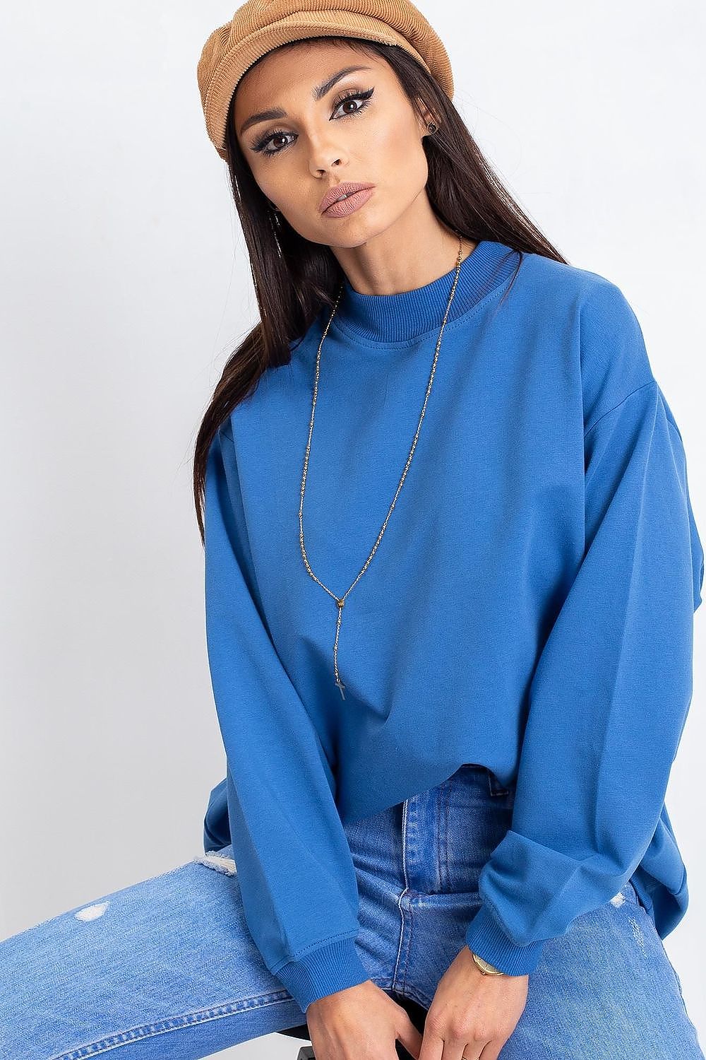Close-up of a Luxury Women's Cotton Sweatshirt with Stand-Up Collar in blue, showcasing its soft fabric and stylish design, accessorised with elegant jewellery.