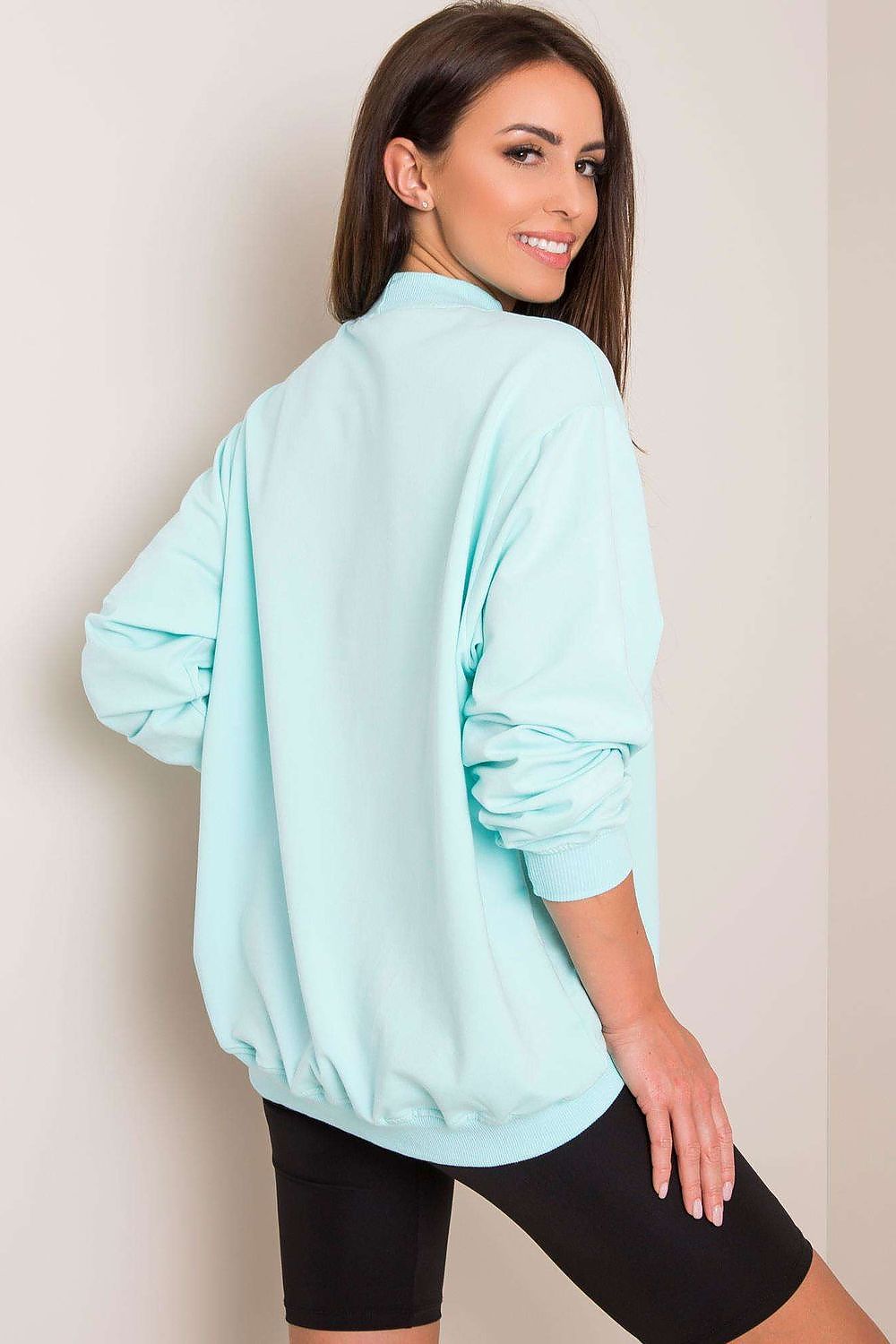 Back view of a Luxury Women's Cotton Sweatshirt with Stand-Up Collar in mint green, highlighting its relaxed fit and trendy silhouette.