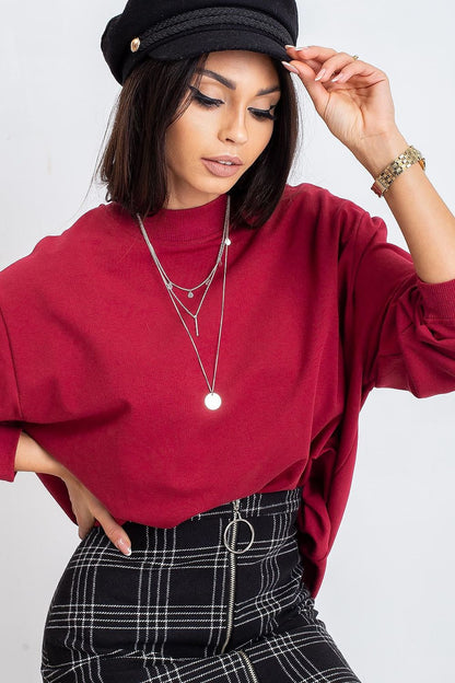 Luxury Women's Cotton Sweatshirt with Stand-Up Collar in rich burgundy, styled elegantly with layered necklaces and a chic plaid skirt, embodying sophistication and style.