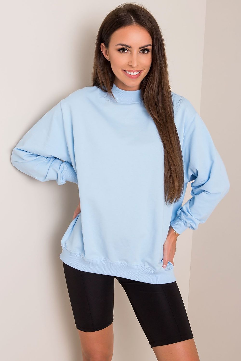 Luxury Women's Cotton Sweatshirt with Stand-Up Collar worn by a model in a soft blue colour, radiating comfort and elegance, perfect for a stylish casual look.