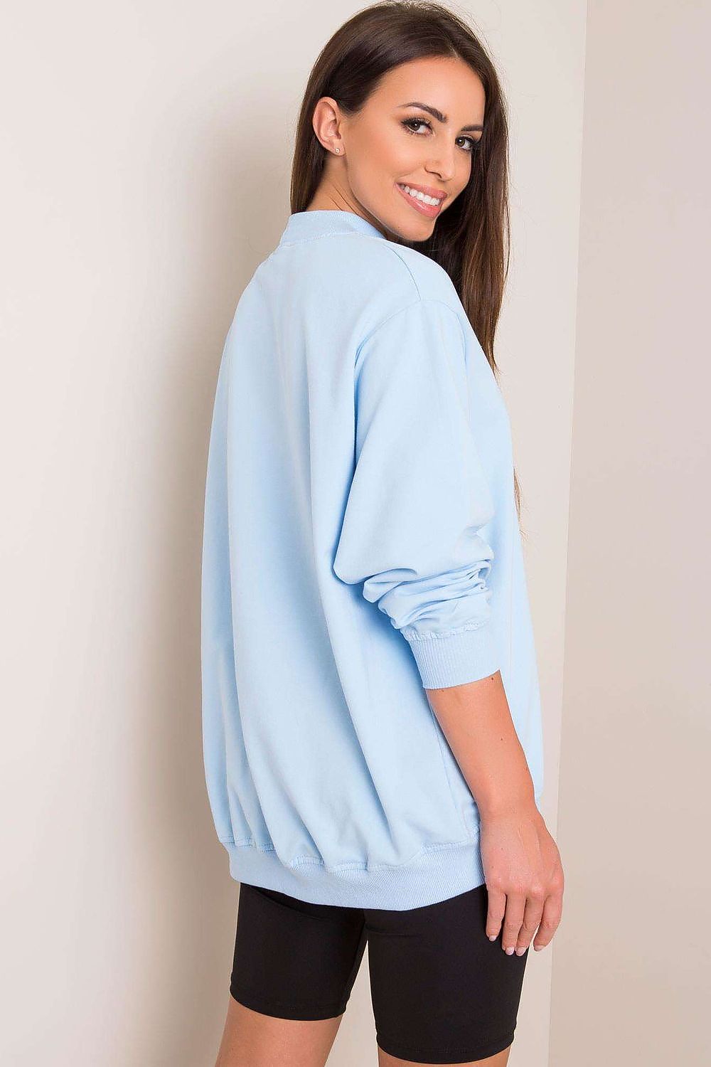 Back view of the Luxury Women's Cotton Sweatshirt with Stand-Up Collar, featuring a model in a blue sweatshirt, showcasing the sophisticated design and relaxed, breathable fit.