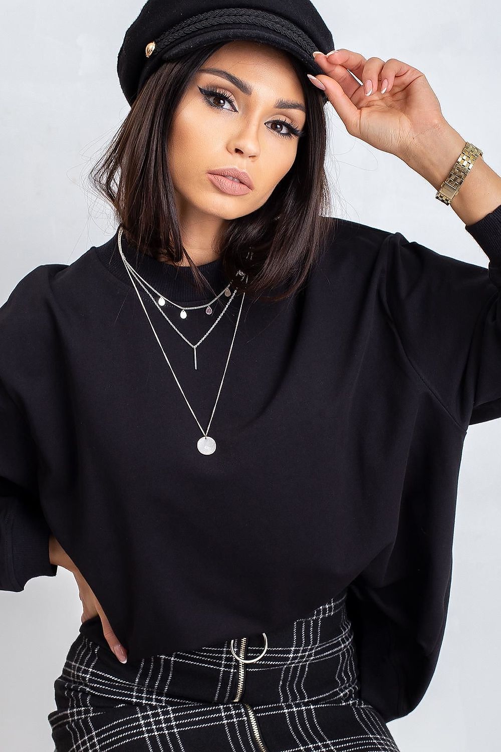 Luxury Women's Cotton Sweatshirt with Stand-Up Collar - Breathable Comfort & Style, showing a model in a stylish black sweatshirt and hat, accentuated with elegant necklaces for a fashionable appearance.