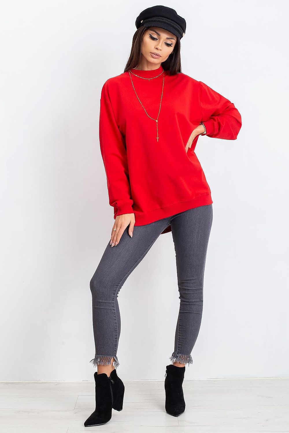Luxury Women's Cotton Sweatshirt with Stand-Up Collar - Breathable Comfort & Style. Model in a vibrant red sweatshirt posing confidently with grey skinny jeans and stylish black boots.