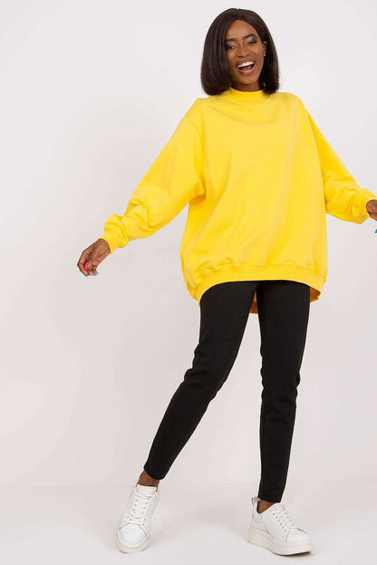 Luxury Women's Cotton Sweatshirt with Stand-Up Collar - Breathable Comfort & Style. Vibrant yellow sweatshirt worn by a model, perfectly paired with black pants for a trendy ensemble.
