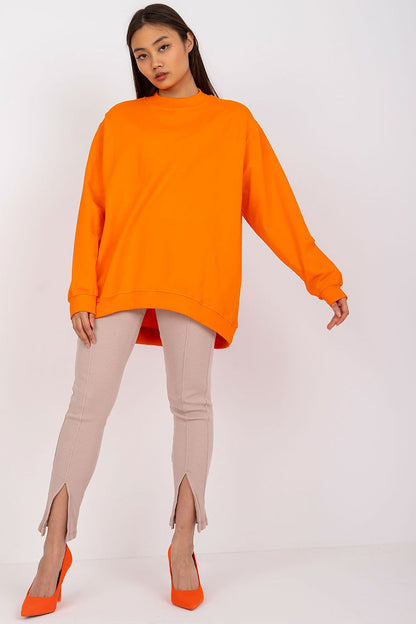 Luxury Women's Cotton Sweatshirt with Stand-Up Collar - Breathable Comfort & Style. Eye-catching orange sweatshirt featured on a model, elegantly matched with stylish beige pants and heels.