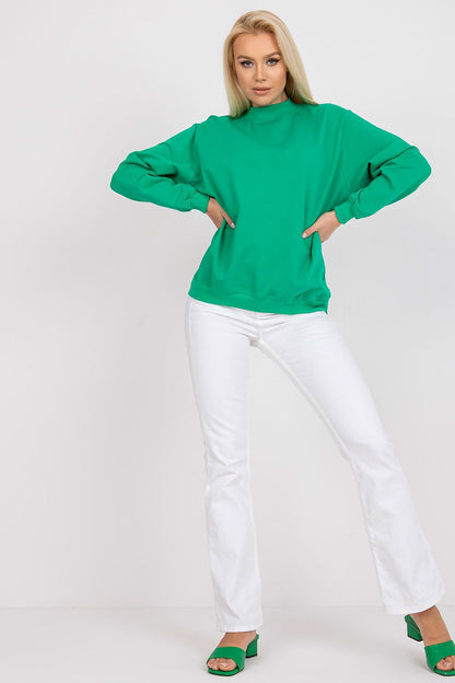 Luxury Women's Cotton Sweatshirt with Stand-Up Collar - Breathable Comfort & Style, featuring a model wearing a vibrant green sweatshirt styled with white flared trousers and green heels.