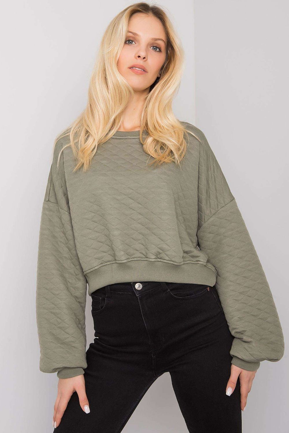 Elegant BFG Quilted Fabric Sweatshirt with Ribbed Hem – Long Sleeves, Perfect for Casual Chic, showcased on a model with flowing blonde hair wearing the stylish olive green sweatshirt paired with black high-waisted jeans.