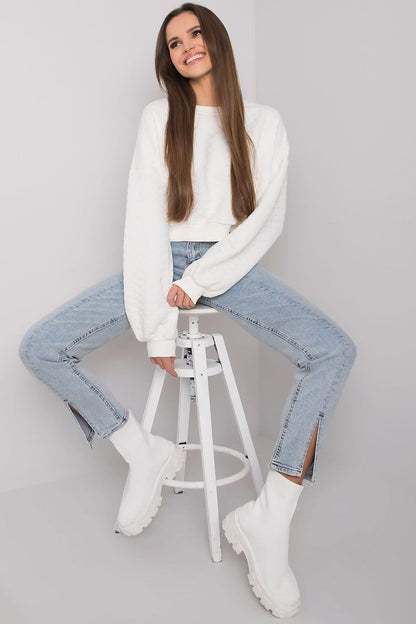 Elegant BFG Quilted Fabric Sweatshirt with Ribbed Hem – Long Sleeves, Perfect for Casual Chic, presenting a close-up of the white sweatshirt worn casually while seated.