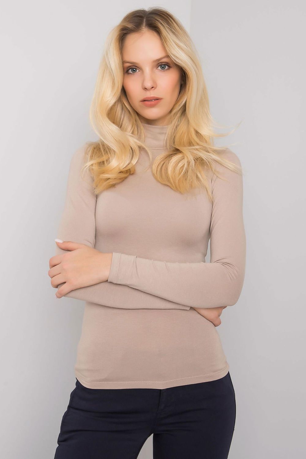 Elegant model showcasing the Luxury Long-Sleeve Turtleneck by Rue Paris, designed in a soft beige hue, crafted from 90% viscose for ultimate comfort and style.