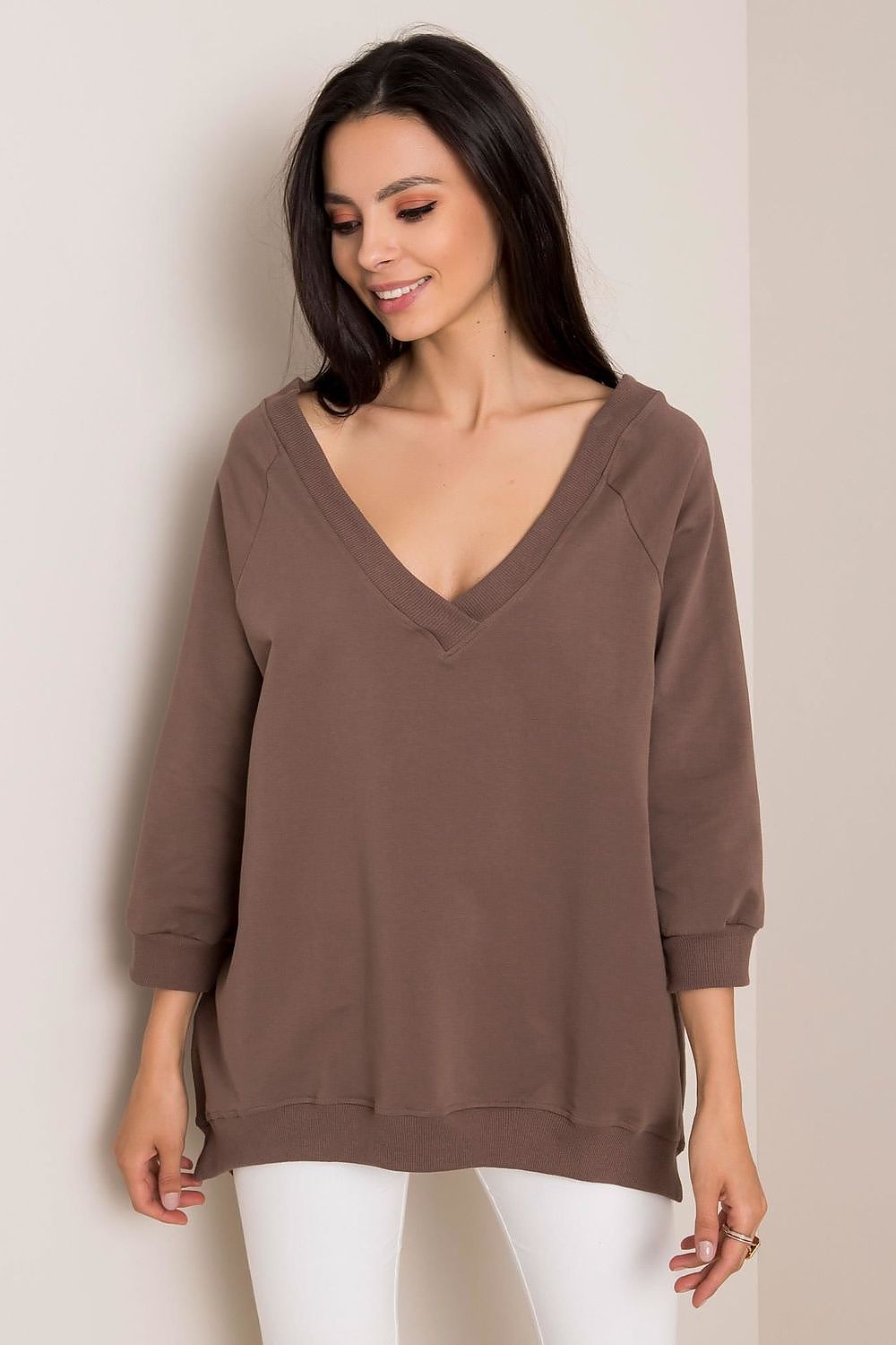 Sophisticated Loose Fit Rue Paris Sweatshirt With Heart Neckline in warm brown, model smiling while wearing stylishly, designed for comfort with 90% cotton and 10% spandex.