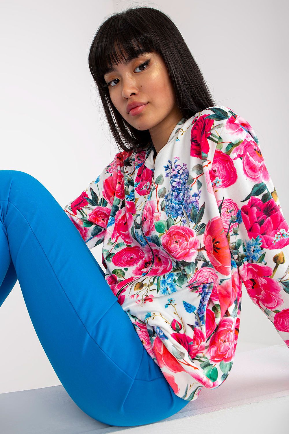 Exquisite floral print Luxurious Women's Zip-Up Sweatshirt by Rue Paris with Side Pockets, worn by a model showcasing effortless style.