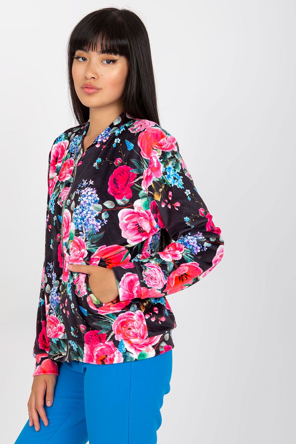 Luxurious Women's Zip-Up Sweatshirt by Rue Paris featuring a stunning floral pattern and convenient side pockets, elegantly styled on a model, showcasing the vibrant design and comfortable fit.