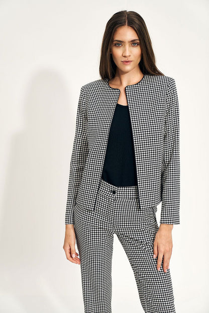 Luxury Nife Peplum Jacket for Women in a stylish monochrome pattern, paired with trousers, embodying minimalist elegance. Perfect for office wear.