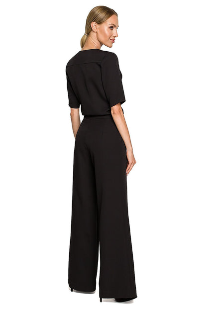 Elegant Wide Leg Trouser Suit with Elbow-Length Sleeves and Pockets - Designed by Moe, showcasing a model from the back in a refined black ensemble, highlighting sophisticated tailoring.