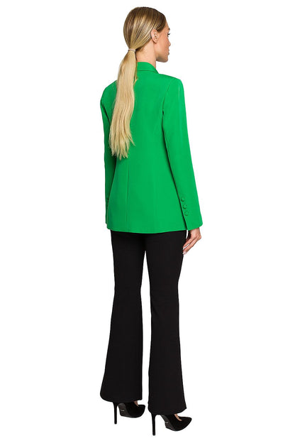 Elegant Women's Blazer Jacket with Feminine Fit, Classic Collar & Versatile Patch Pockets - Back view of a model wearing a vibrant green blazer paired with sleek black bell-bottoms.