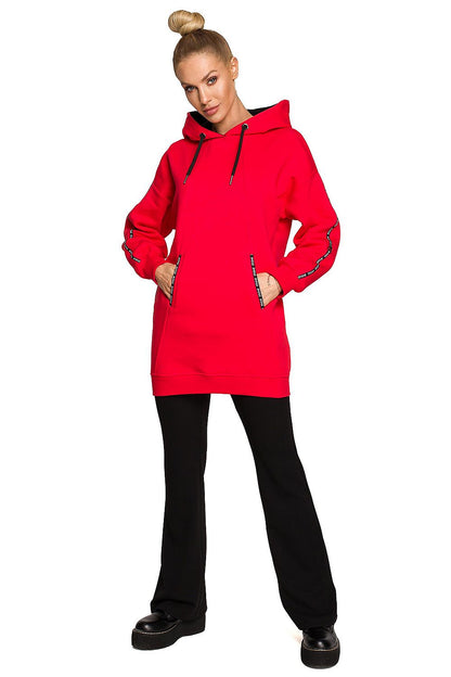Moe Luxury Fleece-Lined Sweatshirt Tunic in vibrant red, modelled casually, demonstrating versatility in style for casual outings or lounging.