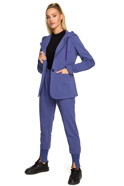 Moe Luxe Knitted Fabric Jacket with Hood and Pockets showcased in blue, elegantly styled with matching trousers and black sneakers, featuring a unique collar-to-hood design.