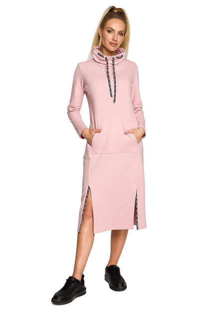 Moe Daydress: Elegant Midi Dress with Unique Weave and Comfortable Knit Fabric, featured in a soft pink hue, elegantly styled with a high collar and side slits, perfect for both casual and formal occasions.