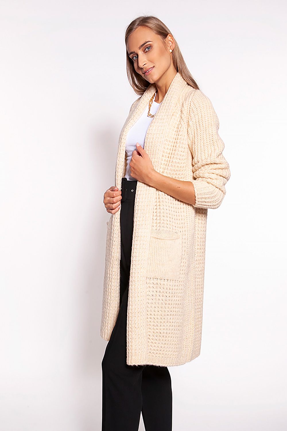 Elegant MKM Waffle Textured Cardigan With Shawl Collar And Practical Pockets - Knee-Length Design, featuring a model showcasing the plush cardigan in a warm beige shade, highlighted by its luxurious shawl collar and convenient patch pockets.