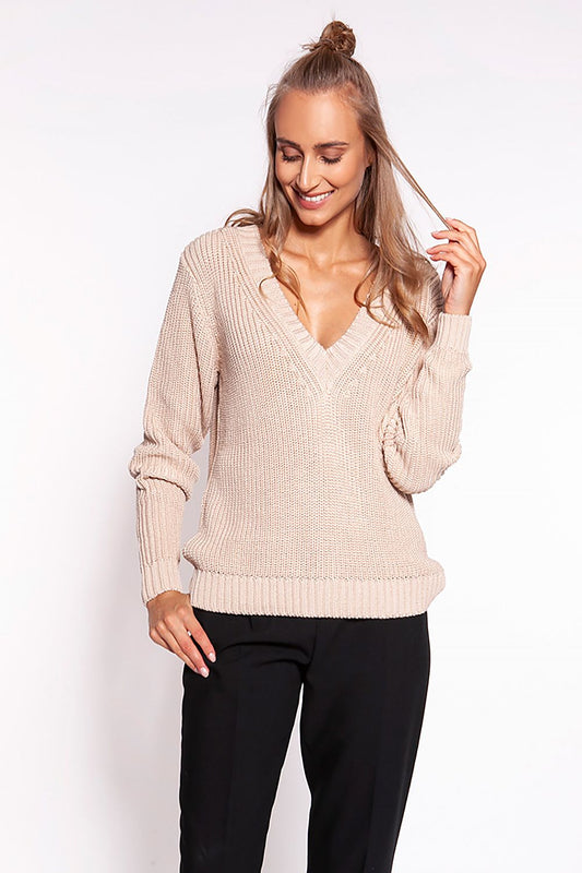 Luxurious Minimalist Ribbed Knit Jumper with Deep Heart Neckline by MKM, model showcases the beige jumper styled with tailored black trousers, highlighting its casual elegance.