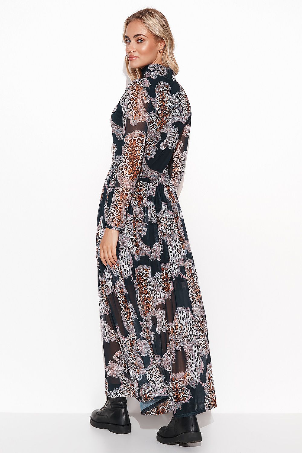 A full view of the airy Makadamia maxi dress, highlighting its subtle draping and elegant transparent elements.