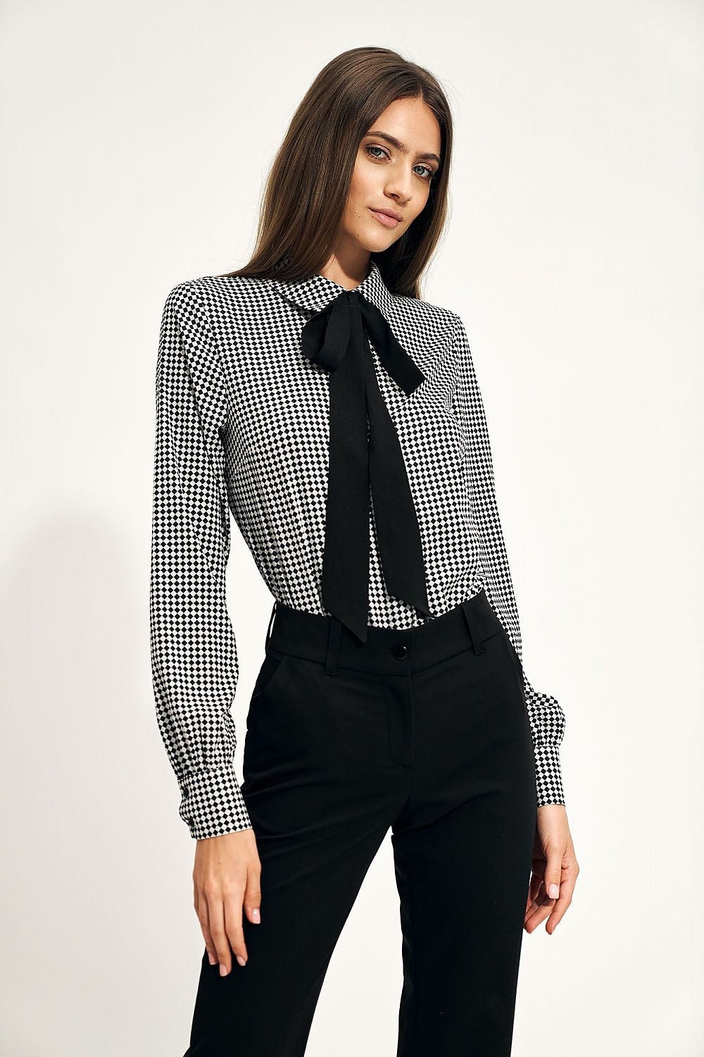 Elegant Long Sleeve Bow Shirt by Nife showcased on a model, featuring a stylish black and white checkered print, perfect for sophisticated office wear.