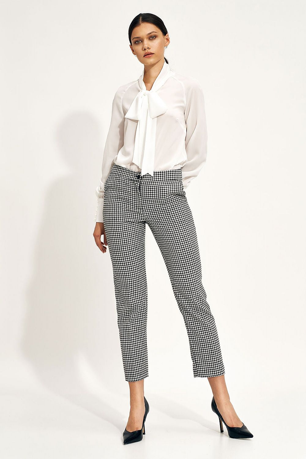 Elegant Ecru Blouse With Decorative Neck Tie and Wide Cuff Sleeves by Nife, showcased in a polished outfit paired with stylish patterned trousers, ideal for a sophisticated look.