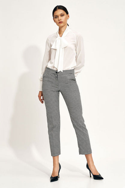 Elegant Ecru Blouse With Decorative Neck Tie and Wide Cuff Sleeves by Nife, showcased in a polished outfit paired with stylish patterned trousers, ideal for a sophisticated look.