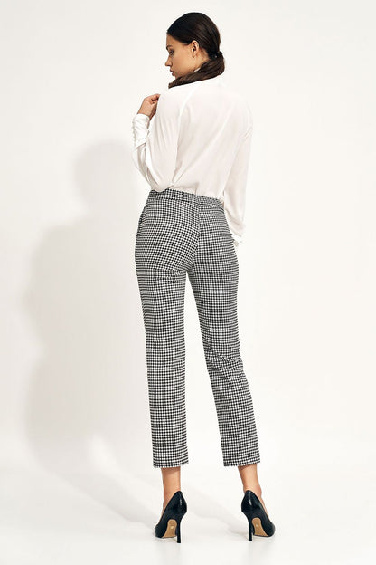 Back view of the Elegant Ecru Blouse With Decorative Neck Tie and Wide Cuff Sleeves by Nife, highlighting its elegant design and perfect fit when paired with tailored trousers.