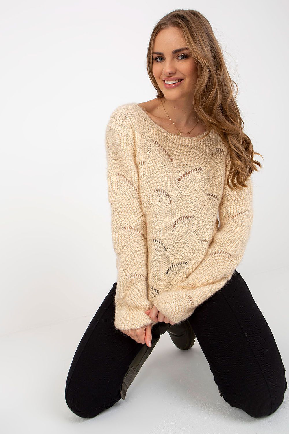 Elegant Och Bella Openwork Sweater with Long Sleeves and Boat Neckline, showcased in a luxurious knitwear style, featuring delicate openwork details and a soft beige hue, modeled by a smiling woman in a chic pose.