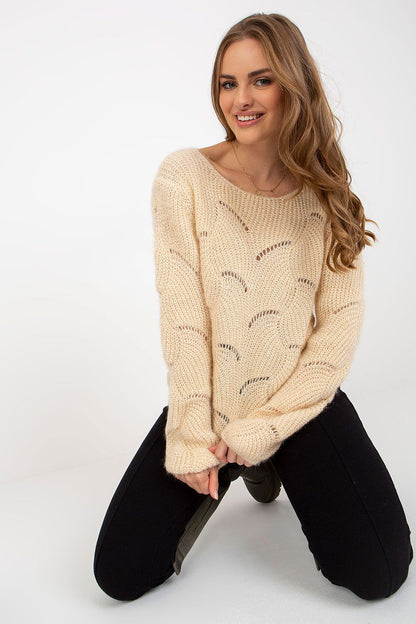 Elegant Och Bella Openwork Sweater with Long Sleeves and Boat Neckline, showcased in a luxurious knitwear style, featuring delicate openwork details and a soft beige hue, modeled by a smiling woman in a chic pose.