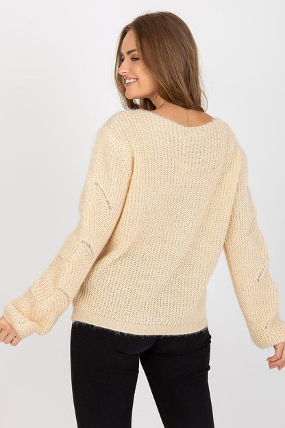 Back view of the Och Bella Openwork Sweater with Long Sleeves and Boat Neckline, highlighting its luxurious knit texture and stylish silhouette.