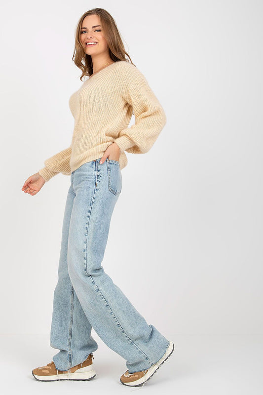 Chic Women's Heart Neckline Jumper by Och Bella, showcased in a graceful side view. This long sleeve wool blend sweater in a delicate beige hue is complemented with modern blue jeans, capturing an effortlessly chic aesthetic.