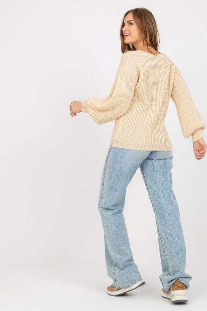 Chic Women's Heart Neckline Jumper by Och Bella - Long Sleeve Wool Blend Sweater, featuring model wearing a beige sweater with balloon sleeves and relaxed fit paired with stylish blue jeans.