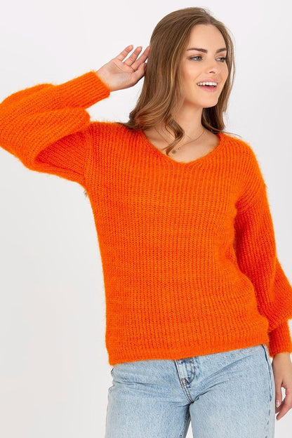 Chic Women's Heart Neckline Jumper by Och Bella - Long Sleeve Wool Blend Sweater, showcasing a vibrant orange sweater on a model, elegantly styled with blue jeans and a radiant smile.