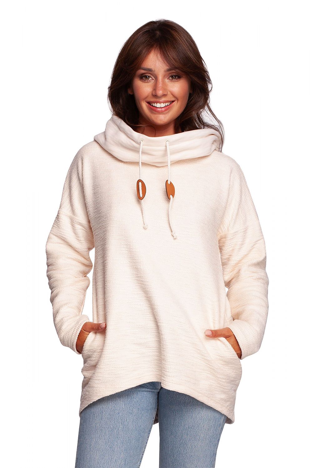 BeWear Oversized Cotton Blend Hooded Sweatshirt Tunic for Comfortable Cold Weather, featuring a luxurious cream colour, a cosy hood, and side pockets, modelled by a smiling woman.