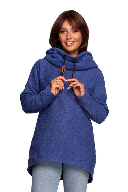 Chic model wearing the BeWear Oversized Cotton Blend Hooded Sweatshirt Tunic in deep blue, offering a stylish and cosy look for chilly days.