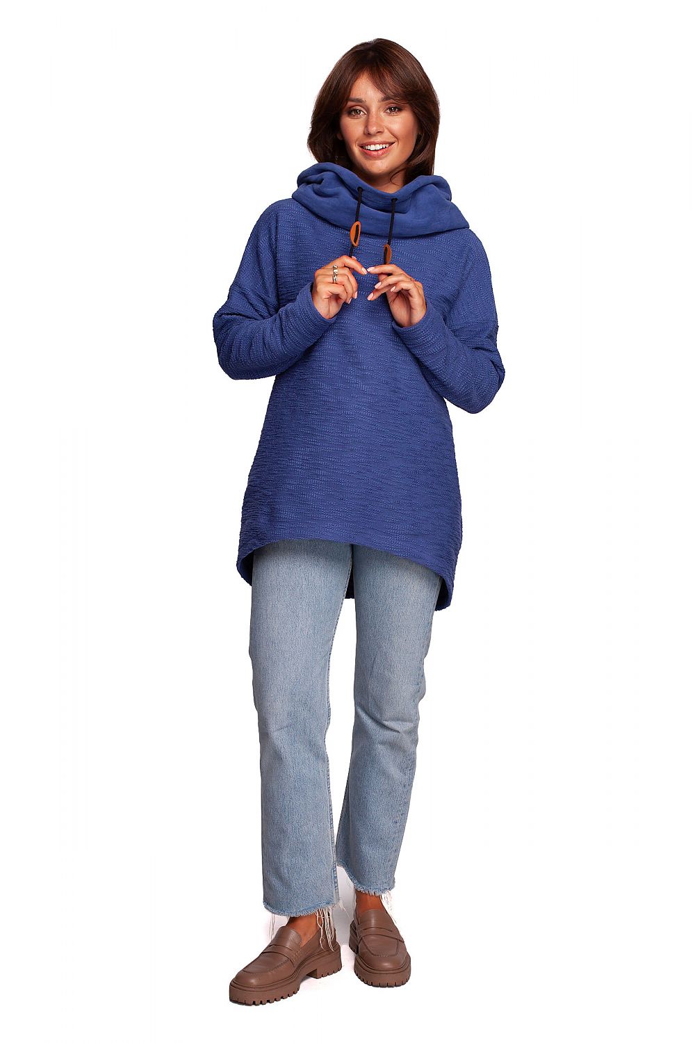 Fashionable woman in the BeWear Oversized Cotton Blend Hooded Sweatshirt Tunic, vibrant blue, ideal for luxurious warmth in cold weather.