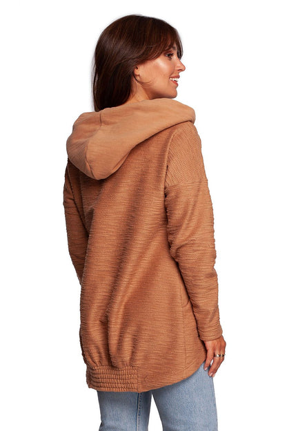 Elegant profile of the BeWear Oversized Cotton Blend Hooded Sweatshirt Tunic in beige, highlighting its luxurious texture and warm design suitable for stylish winter wear.