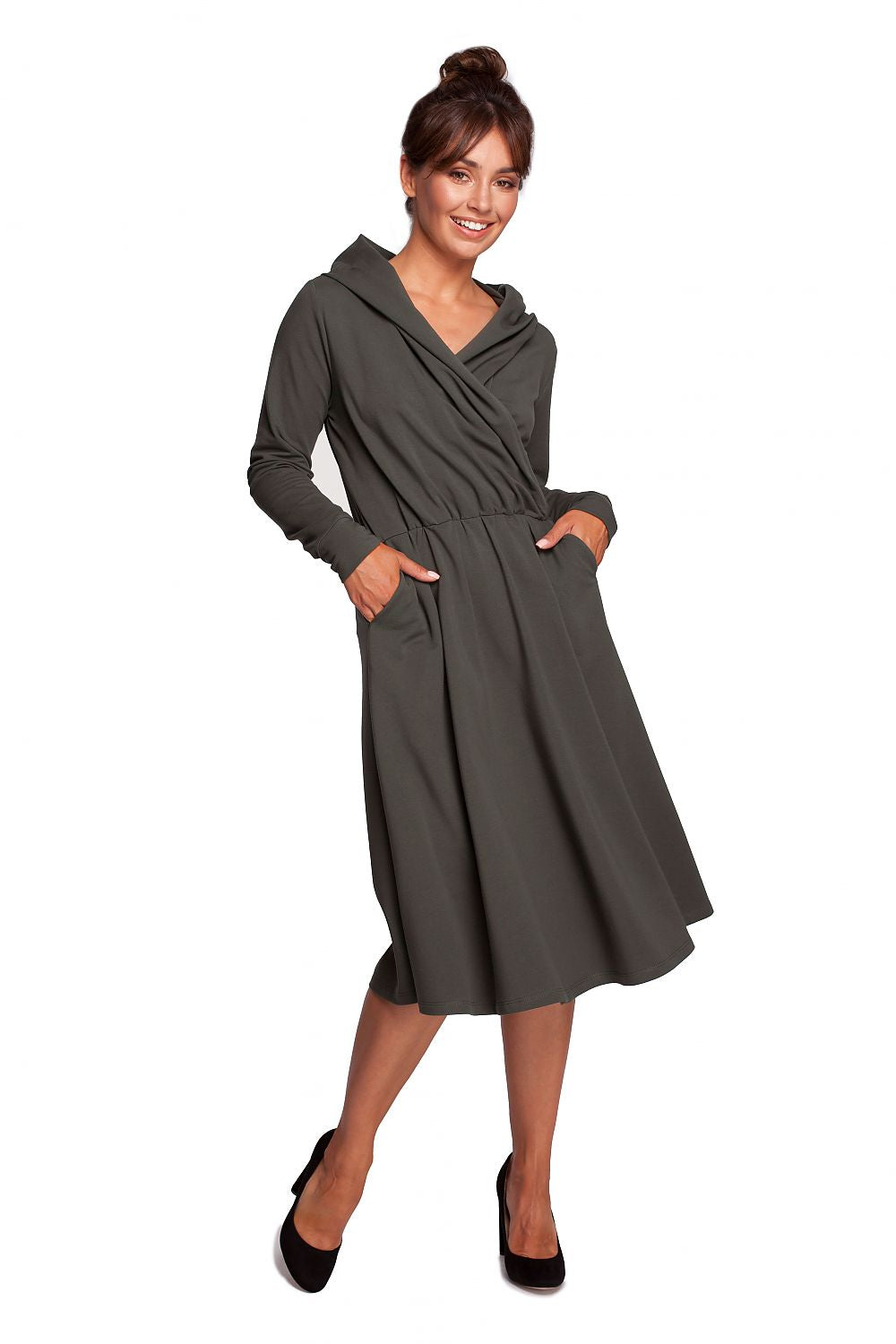 Luxury flared daydress with hood and draped envelope top by BeWear, featuring a stylish design in a soft cotton and spandex blend. Model showcasing the elegant dress with a flared silhouette and practical side pockets.